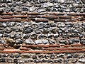 Close-up of the wall of the Roman shore fort at Burgh Castle, Norfolk, showing alternating courses of flint and brick