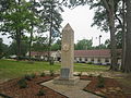 This obelisk erected in 1976 in Bicentennial Park in Haynesville is dedicated to the medical profession. The site is at the former location of a hospital.