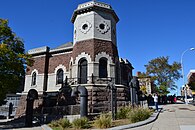 135th St Croton Aqueduct Gatehouse in New York City has a brick two story octagonal tower with stone work at its base