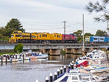 A diesel infrastructure evaluation carriage crossing a bridge at Mordialloc