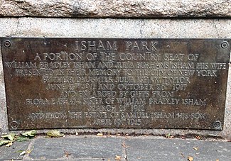 The plaque mentioned above is situated opposite from the two marble benches.