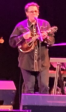 Ross Holmes, playing a mandolin