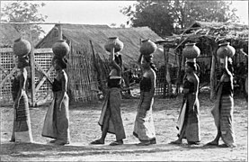 Burmese women carrying water