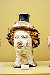 Terracotta vase in the shape of Dionysus' head (circa 410 BC) – on display in the Ancient Agora Museum in Athens, housed in the Stoa of Attalus