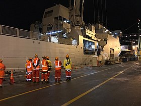 Baggage of evacuees being unloaded off HMNZS Canterbury