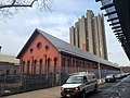 Tracey Towers from Jerome Avenue, with the red-bricked High Pumping Station in the foreground.