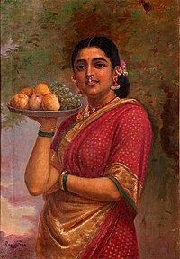 Indian woman with a plate of fruits