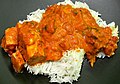 Image 5Chicken tikka masala, served atop rice. An Anglo-Indian meal, it is among the UK's most popular dishes. (from Culture of the United Kingdom)