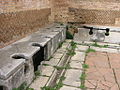 Image 10Public toilets (latrinae) from Ostia Antica (from Roman Empire)