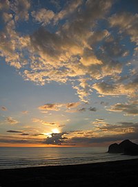 Sunset at Te Henga (Bethells Beach), West of Auckland, New Zealand.