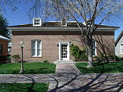 The Wolf-Sachs-Mrs. G.A. Goodwin House was built in 1896. It was dismantled from it's original location and rebuilt at 150 S. Ash Ave in 1992 in Tempe's Olde Towne Square. The house is listed as "Historic" in the Tempe Historic Property Survey.