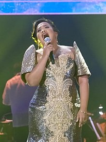 Escalante in December 2021 performing at the 90th anniversary of the Manila Metropolitan Theater