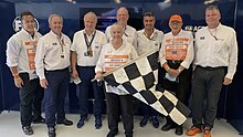 Suzanne Royce with FIA officials following the presentation of the 2021 US Grand Prix checkered flag.