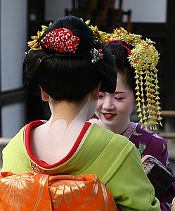 Two Geisha conversing near the Golden Temple in Kyoto, Japan (photo by Daniel Bachler)