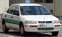 1995–1996 Mazda Familia sedan AWD (Japan) with North American market front bumper