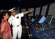 President Gloria Macapagal Arroyo listens to MAAP president in her visit to the academy.