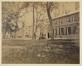 Arsenal, north front. Interior court - group of officers in foreground