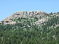 Horsetooth Rock, named for the profile of its east face. Hikers are visible on the summit.