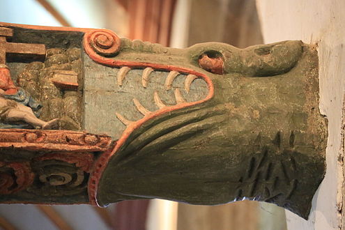 Carving at the end of the rood screen beam