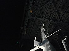 The Queen Mary 2 radar mast passing under the Verrazzano Bridge