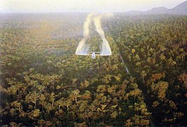 A Fairchild C-123 Provider aircraft spraying defoliant in South Vietnam in 1962.