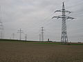 A 110 kV-line with a communication cable hanging like a garland on the ground conductor
