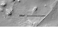 Possible dike in Thaumasia, as seen by HiRISE under HiWish program. Dikes may have deposited valuable minerals.