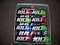 Several types of Jolt Cola cans in a shoebox.