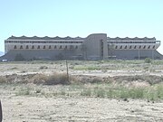 Front of the Phoenix Trotting Park. The structure was built in 1965 and is located at 1068 N Cotton Lane. The harness racing facility closed in December 1966. At about 20 miles from downtown Phoenix, the park's remote location was a major factor in the low rates of attendance.