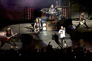 A Day to Remember performing at Saratoga Performing Arts Center in 2016. From left to right: Kevin Skaff, Joshua Woodard, Alex Shelnutt, Jeremy McKinnon, and Neil Westfall.