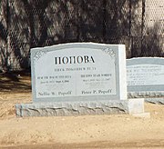 Graves of Nellie and Peter Popoff with Russian inscription.