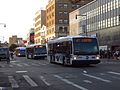 MTA 3rd and 4th Gen LFS buses, followed by a LFS Artic, in Flushing, Queens, NYC.