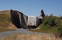 Reconstructed sloped fortification with a rail car inside