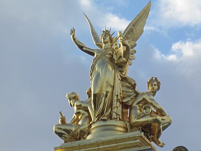 Gumery's L'Harmonie (1869), atop the left avant-corps of the façade, is 7.5 metres (25 ft) of gilt copper electrotype