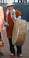 Musician plays Pinkullo flute with one hand and drums a tinya with the other at a Huari Danza in Peru.