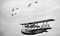 Short Singapore Mk III flying boat of 205 Sqn, in flight below three 'vic' formations of Vickers Vildebeest torpedo bombers of 100 Sqn.