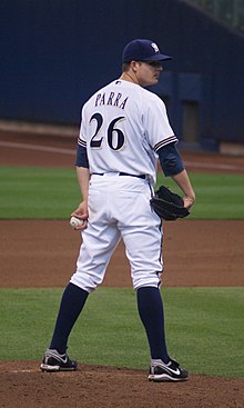 A baseball player in white