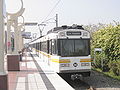 A train departing Willow Station of the LA Metro Rail's Blue Line.