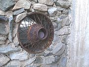 Pictured is a window which Gulley made with the spoke rim of an old car. The castle is designated as a Phoenix Point of Pride.