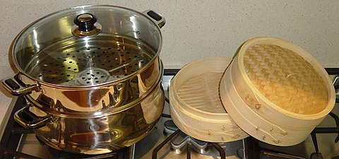 A modern metal steamer and a bamboo steamer