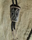 Silver overlay bolo tie by Tommy Singer (Navajo), New Mexico, c. 1980s
