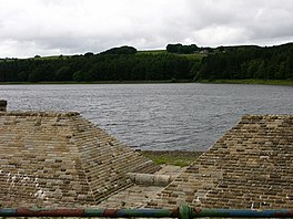 A brick-lined overflow, with a reservoir beyond