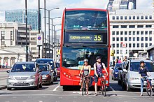 Cars, bikes and a double-decker bus on London Bridge