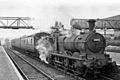 Ex-GWR "Dean Goods" 2301 Class 0-6-0 No.2483 waits at Llanidloes railway station to work a summer afternoon stopping passenger train south towards Builth Wells and Brecon, 29 August 1949.