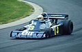 The Tyrrell P34 six-wheeler, driven by Jody Scheckter at the 1976 German Grand Prix, in blue Elf livery.