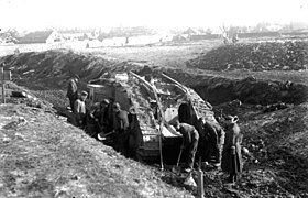 Mark IV tank being dug out by German troops at Cambrai, November 1917
