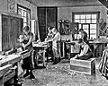 Image 44Students in a carpentry trade school learning woodworking skills, c. 1920 (from Vocational school)