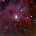 The reflection nebula NGC 1999 (blue cloud in the center) and the Herbig-Haro Objects HH 1/2 below NGC 1999 as small pink clouds.