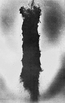 Aerial photograph of blackened area of ice where a B-52 carrying 4 nuclear weapons crashed near Thule Air Base on January 21, 1968.