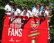 Arsenal players on an open top bus